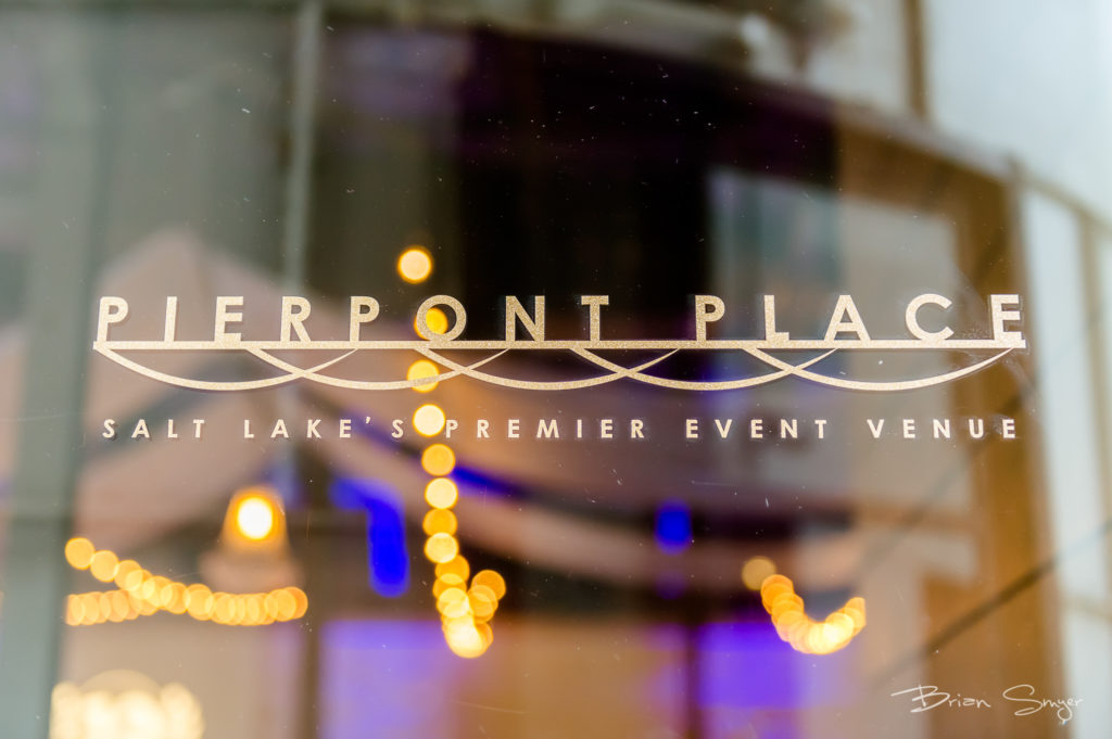 Photo of Pierpont Place logo on front door with lights reflecting